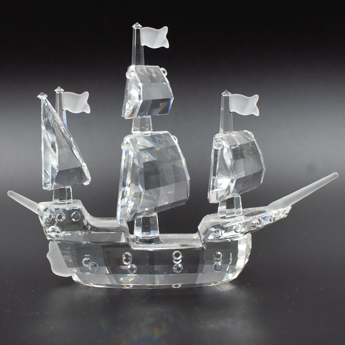 Swarovski Crystal Sail Ship: DESCRIPTION: A Swarovski crystal sail ship composed of overall faceted crystal foundations and frosted crystal embellishment. Marked with a Swarovski backstamp. CIRCA: Late 20th-21st Ct. ORIGIN: Austr