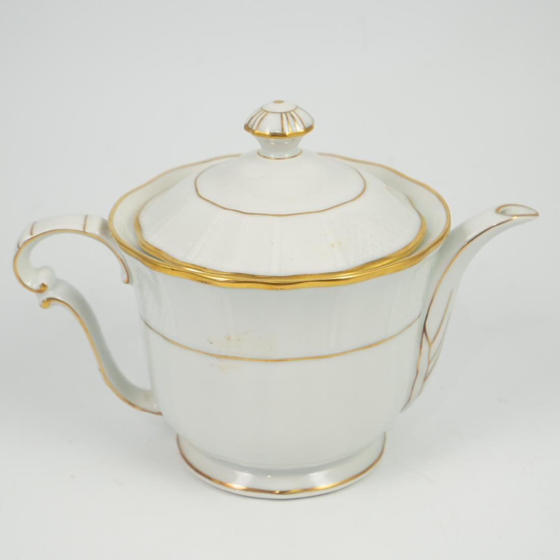 Bernardaud Limoges Malmaison Porcelain Teapot: DESCRIPTION: A Bernardaud Limoges Malmaison porcelain teapot. Decorated with embossed eaved designs and finished in an overall white gloss glaze with gilded trims. CIRCA: Mid-Late 20th Ct. ORIGIN: Fra