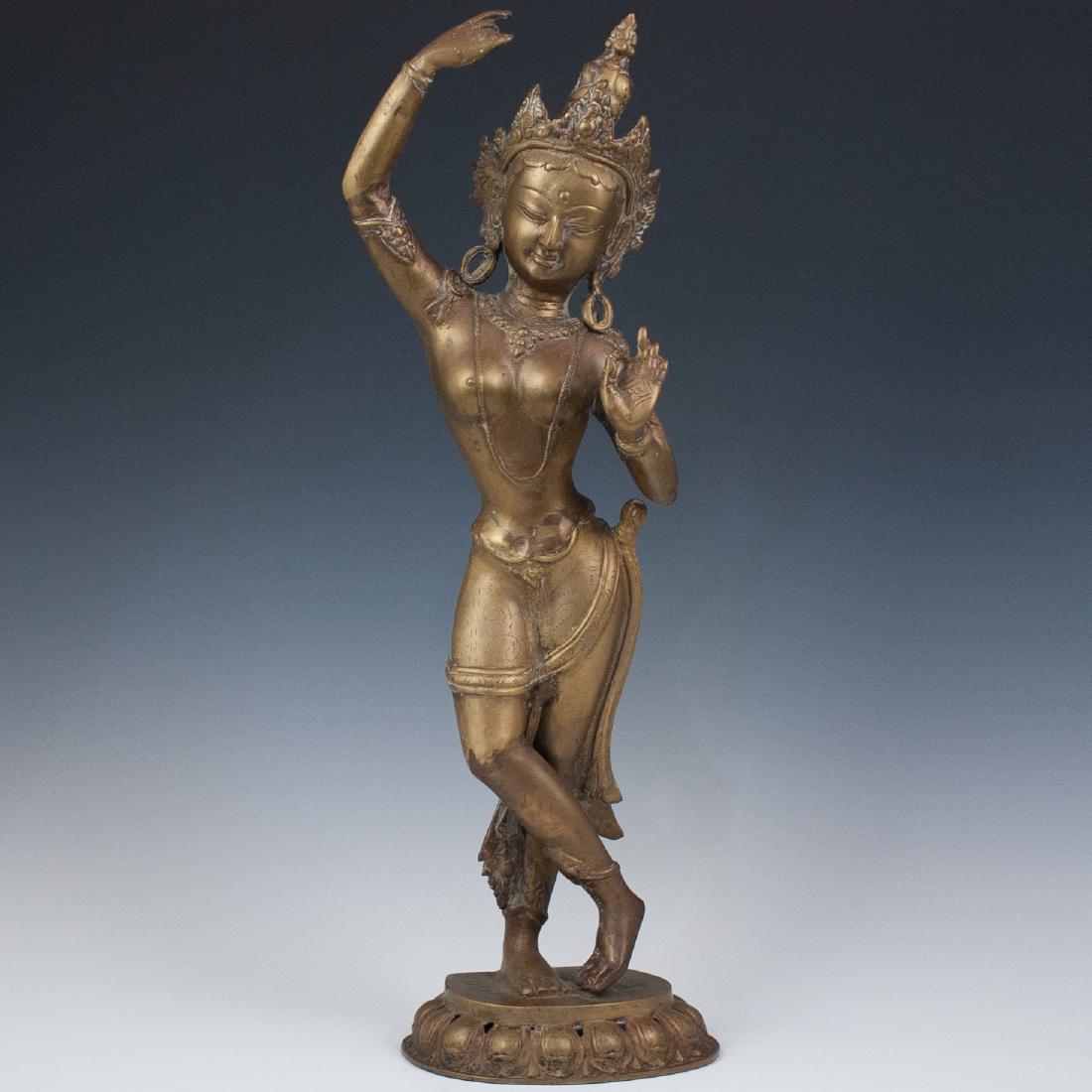 Tara Dancing Buddha Bronze: DESCRIPTION: A gilded bronze depicts dancing Tara buddha known as the "mother of liberation" in Vajrayana buddhism, holding her hands in Vitarka mudra and Jnana mudra positions. CIRCA: Early-Mid 20th 