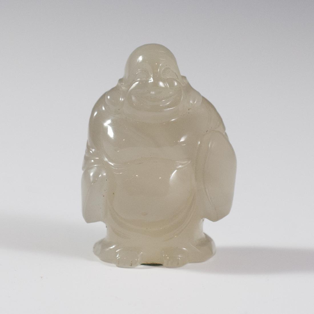Carved Jade Buddha: DESCRIPTION:HAnd carved jade Smiling Buddha with intricate detailing and opaque coloration. CIRCA:19th-20th Ct. ORIGIN:China DIMENSIONS:H:2" L:1.25"