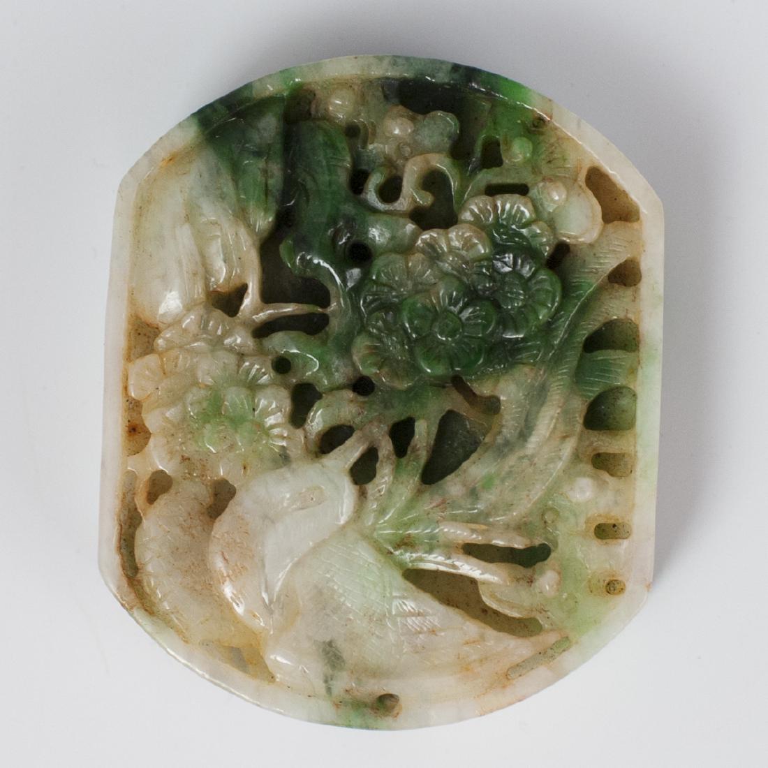 Chinese Carved Two Tone Jade Medallion: DESCRIPTION: A Chinese carved two tone jade medallion embellished with intricately carved floral and bird motifs. Composed of a green and white toned jade foundation. CIRCA: 20th Ct. ORIGIN: China DIM