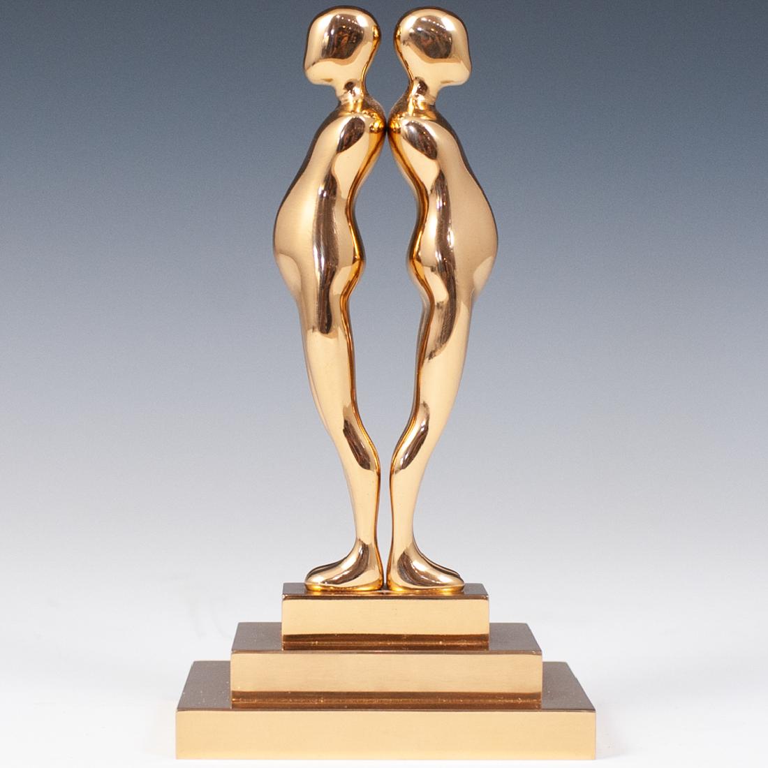 Ernest Trova (American.1927-2009) "Double Study Man": DESCRIPTION: A sculpture by American surrealist Ernest Trova titled double study man sculpture, composed of polished bronze in gilded tones. Engraved with Trova mark, Numbered "83/99" and dated "1986"