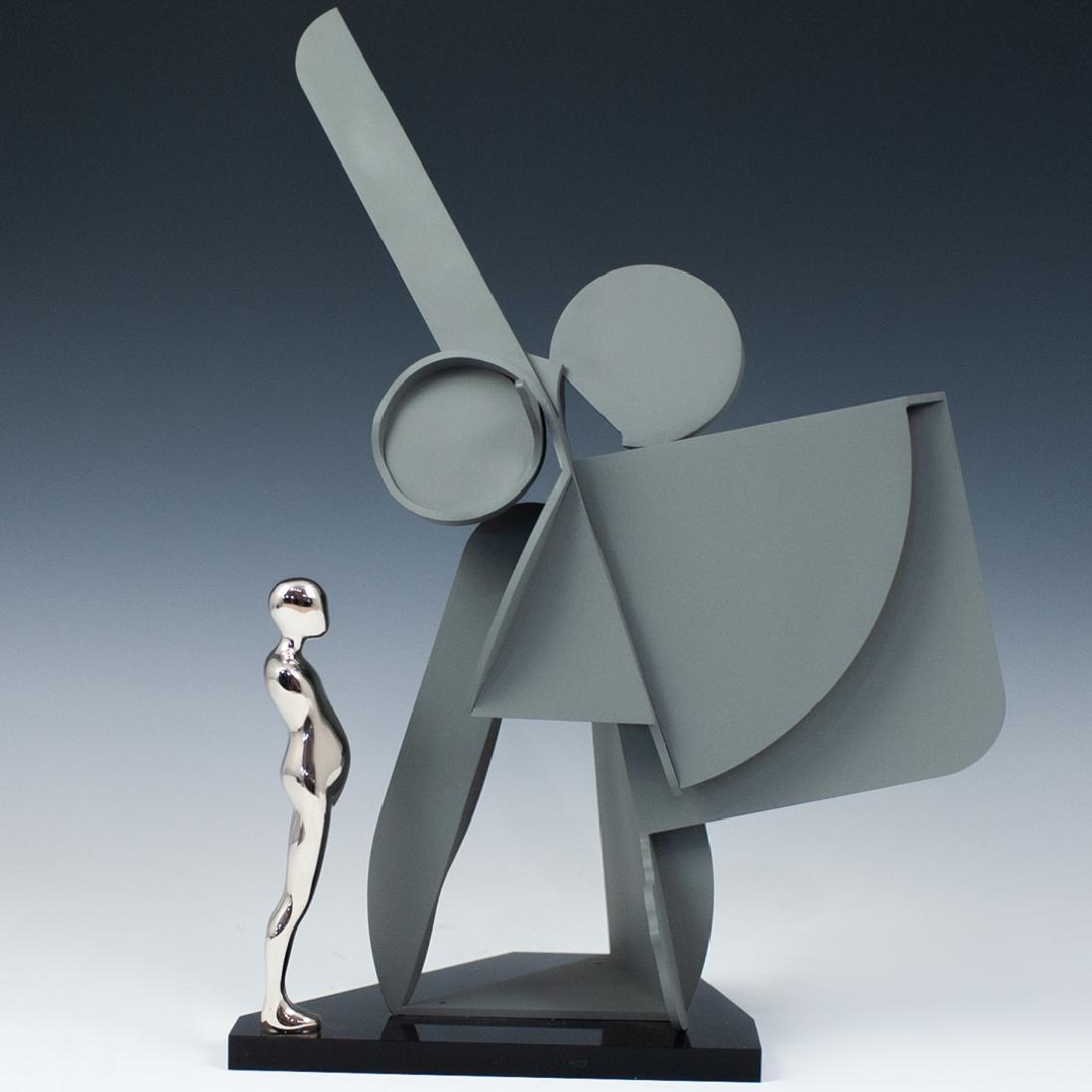 Ernest Trova (American.1927-2009) Study Man Profile: DESCRIPTION: A sculpture by surrealist artist Ernest Trova composed of a cold-rolled steel painted center, fitted with a nickel plated study man figure. Marked along the bottom Edition "22/99" dated 1