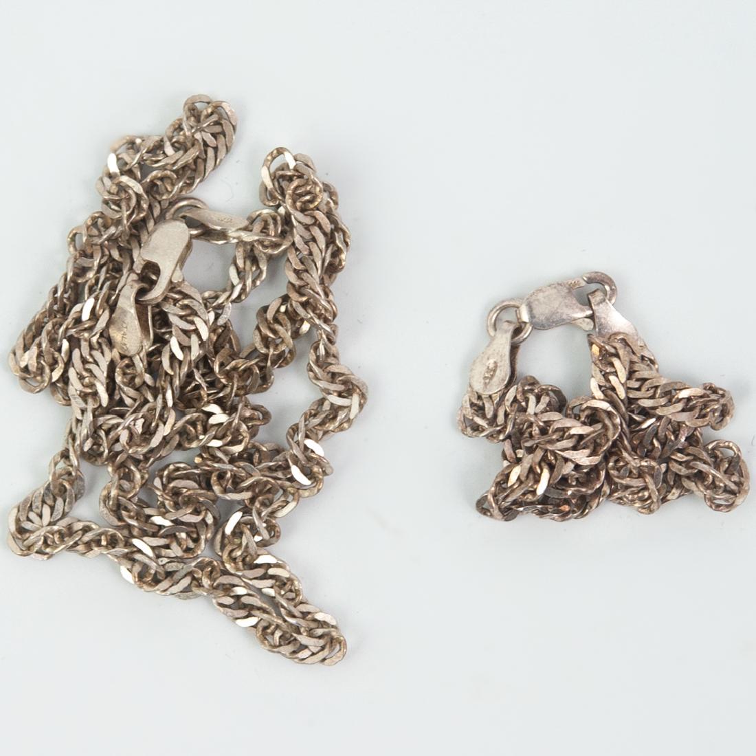 Sterling Bracelet and Necklace Set: DESCRIPTION: A Sterling silver bracelet and necklace set. In the helix chain link pattern, finished with a lobster claw clasp. Hallmarked on the clasp: "925 Italy". Total weight: 13 grams. CIRCA: 20th