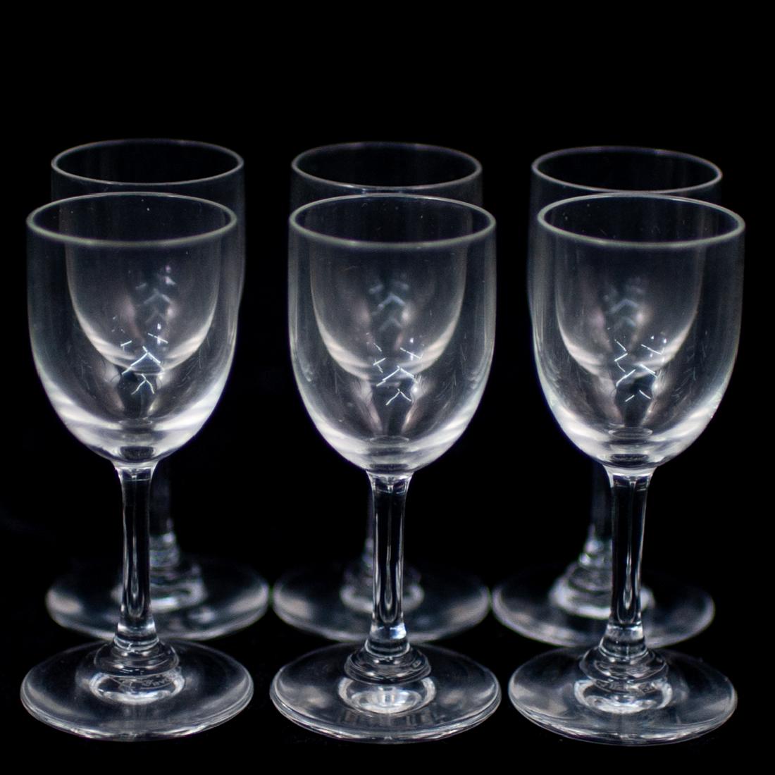 (6 Pc) Baccarat Chalice Glasses: DESCRIPTION: 6-piece Baccarat Crystal chalice glasses. Features wine stem design on rounded base. Etched on the underside: "Baccarat France" CIRCA: 20th Century ORIGIN: France DIMENSIONS: H. 3.5" COND