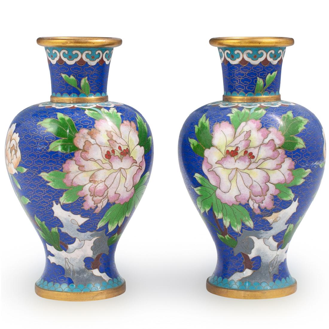 Pair Of Chinese Cloisonne Vases: DESCRIPTION: A Pair of Chinese cloisonne vases feature in an overall cobalt blue ground hue, embellished with enamel lotus flowers and accented by gilded copper wiring. CIRCA: Mid 20th Cent. ORIGIN: C