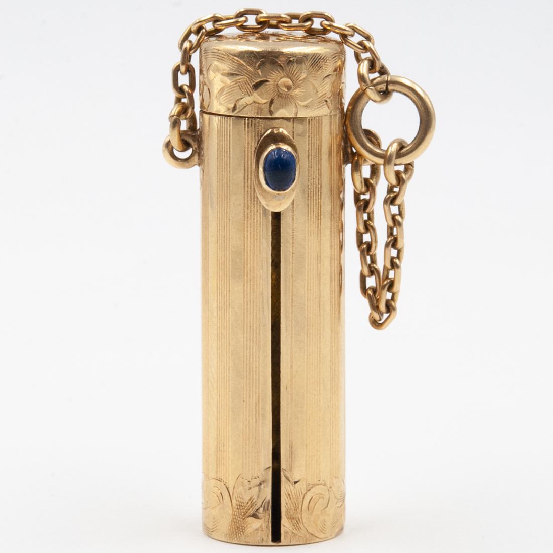 Vintage 14K Gold Lipstick Holder: DESCRIPTION: A Vintage 14K yellow gold lipstick holder. Features solid 14k gold lipstick case with hinged monogrammed lid, a sapphire pendant slide up feature and attached chain. The lid and base of t