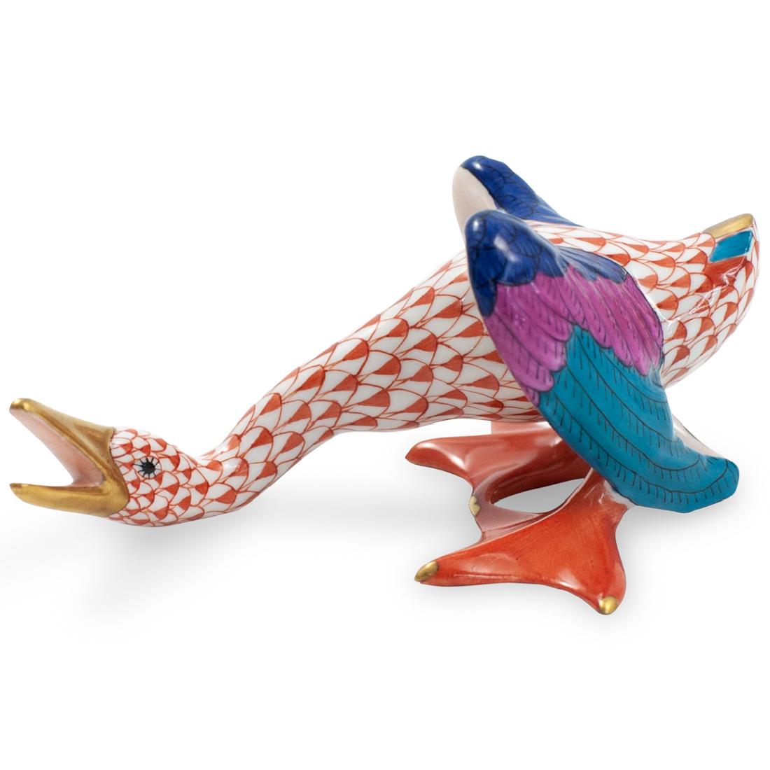 Herend Porcelain Fishnet Hissing Goose: DESCRIPTION: A Herend porcelain figurine depicts a hissing goose in an overall rusted tone fishnet pattern, further embellished with multicolored wings and gilded accents. Marked along the underside w
