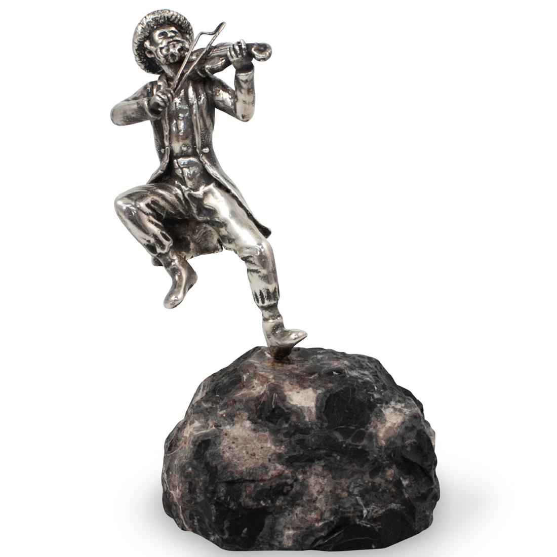 Judaic Sterling and Marble Sculpture: DESCRIPTION: A judaic sterling silver figurine. Portrays a hasidic musician playing the violin, fitted atop a rugged black and marble base. Weight of Figurine: 36 grams CIRCA: 20th cent. ORIGIN: Israe