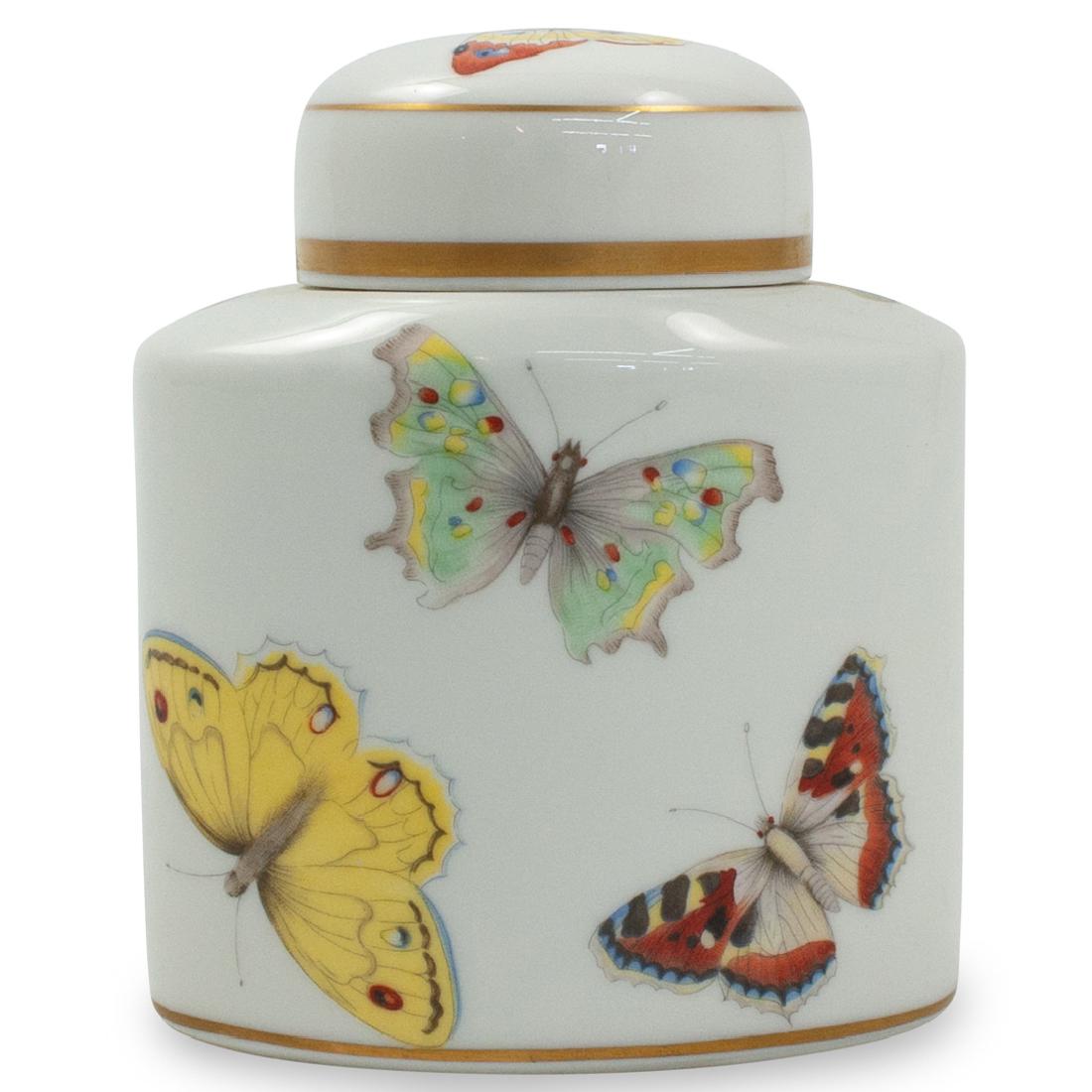 Limoges Porcelain Jar: DESCRIPTION: A Limoges porcelain jar embellished along the body and top with multicolored butterfly motifs. Stamped along the underside "Limoges France". CIRCA: Mid-Late 20th Cent. ORIGIN: France DIME
