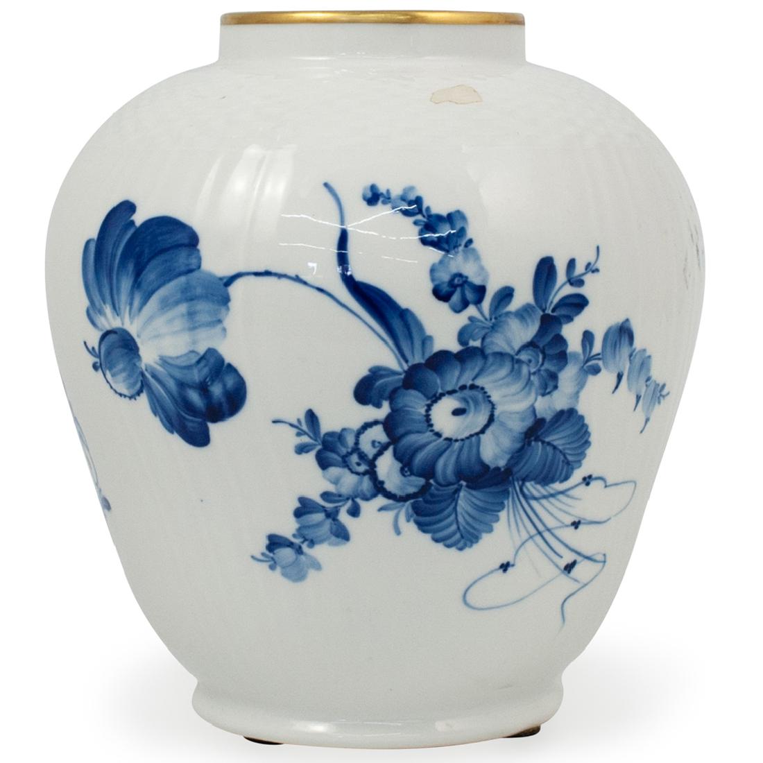 Royal Copenhagen Porcelain Urn: DESCRIPTION: A Royal Copenhagen porcelain urn. In the Blue Flower pattern. Features a ginger jar shape with a white textured ground with blue floral decoration. Marked on the underside: "Royal Copenha