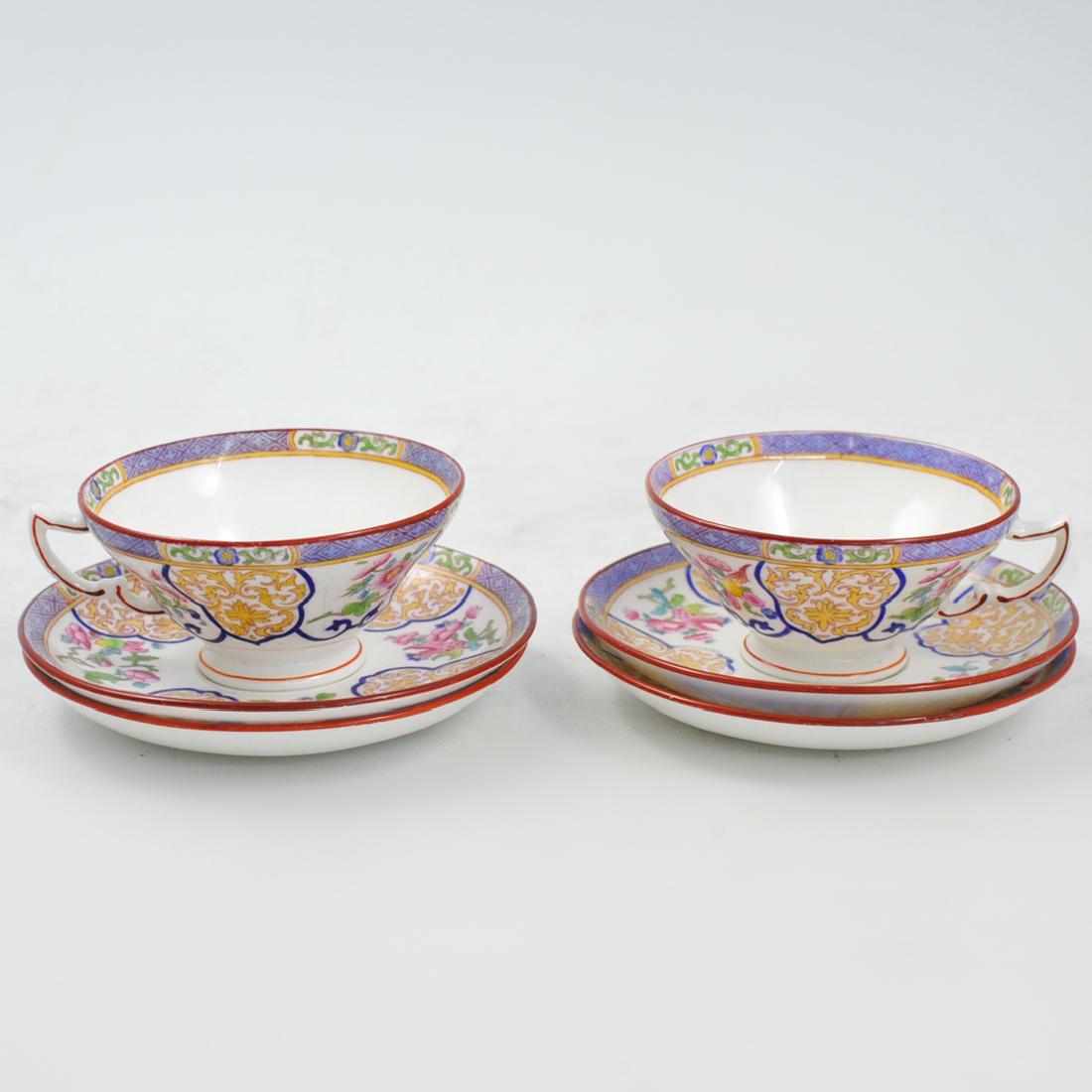 (6 Pc) Mintons Porcelain Teacup and Saucers: DESCRIPTION: A 6-piece Shelley Bone China tea cup and saucer set. Embellished with enameled floral motifs and butterflies atop branches. Marked: "Mintons England" Including 2 tea cups and 4 saucers. C