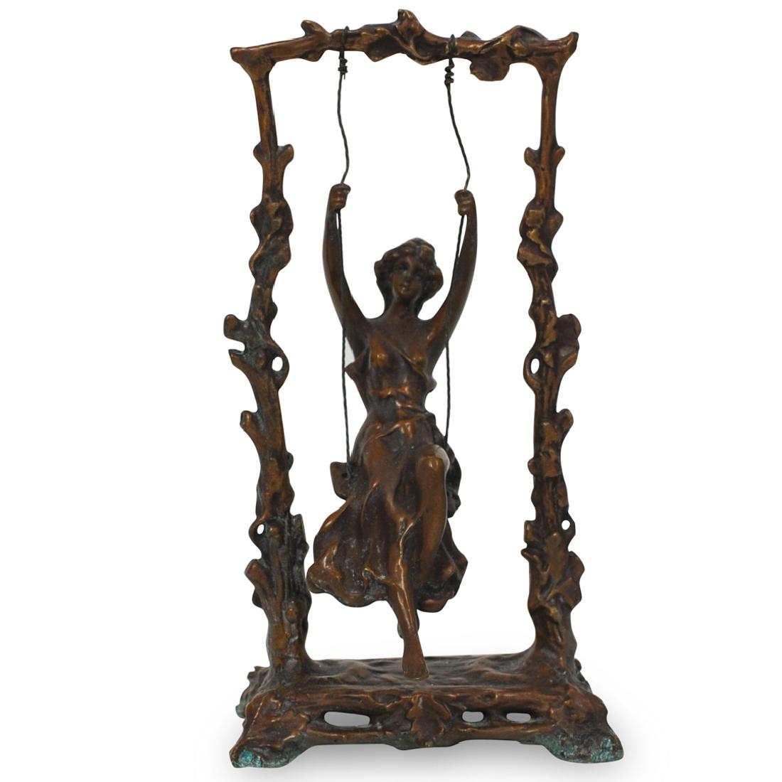After Auguste Moreau (French, 1834-1917) Bronze: DESCRIPTION: A bronze patinated sculpture after Auguste Moreau. Titled "Girl on Swing". Depicting a young female swinging from a branch. No apparent markings. CIRCA: 20th Century ORIGIN: France DIMENS