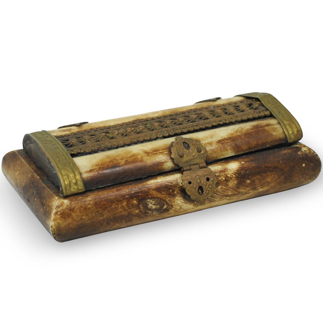 Oriental Bone Trinket Box: DESCRIPTION: An oriental carved bone trinket box embellished along the lid with brass filigree design, opens revealing a purple fabric lined interior. CIRCA: Mid 20th Cent. ORIGIN: Possibly Morocco DI
