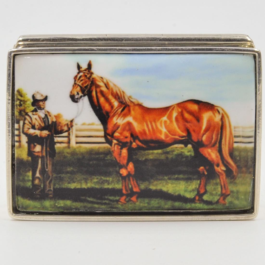 Sterling Silver and Enamel Pill Box: DESCRIPTION: A Sterling silver and enamel pill box. Features a horse standing next to gentleman. Marked "Sterling". Weight: 38.7 grams. CIRCA: 20th Century ORIGIN: Continental DIMENSIONS: L. 1. 7/8" C