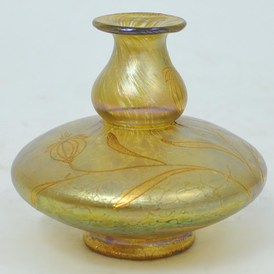 Iridescent Art Glass Vase: DESCRIPTION: An Iridescent globular art glass vase. Of squat globular form, with painted gold leaf flowers on an iridescent gold with purple and clear highlights. No apparent markings. CIRCA: 20th Cen