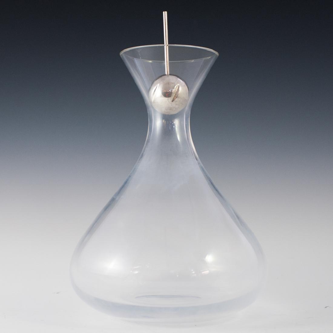 L'Atelier Du Vin "1926" Crystal Developer Decanter: DESCRIPTION: A L'Atelier Du Vin. "1926" crystal wine decanter with developer. Features a bulbous beaker form with fluted neck and rim. Includes a silver plated wine developer with 6 slits that allow t
