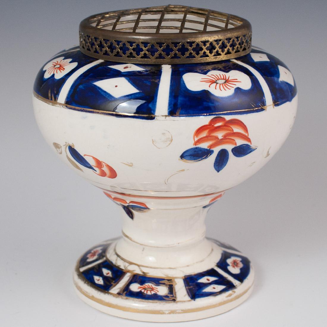 Arthur Wood "Gaudy Welsh" Porcelain Vase: DESCRIPTION: An antique Arthur Wood "Gaudy Welsh" Imari patterned porcelain vase. Embellished with rust, cobalt, and gilded accents. Finished with an open work gridded lid composed of brass. Marked wi