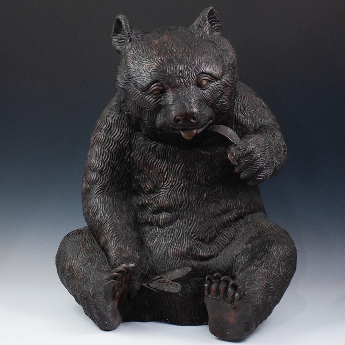 Signed "A. Tiot" Bronze Panda Bear: DESCRIPTION: A Bronze Seated Panda Bear Sculpture. The panda in a brown patina is depicted eating a bamboo stick. Signed on lower right paw, "A. Tiot" CIRCA: 20th Century ORIGIN: France DIMENSIONS: H.