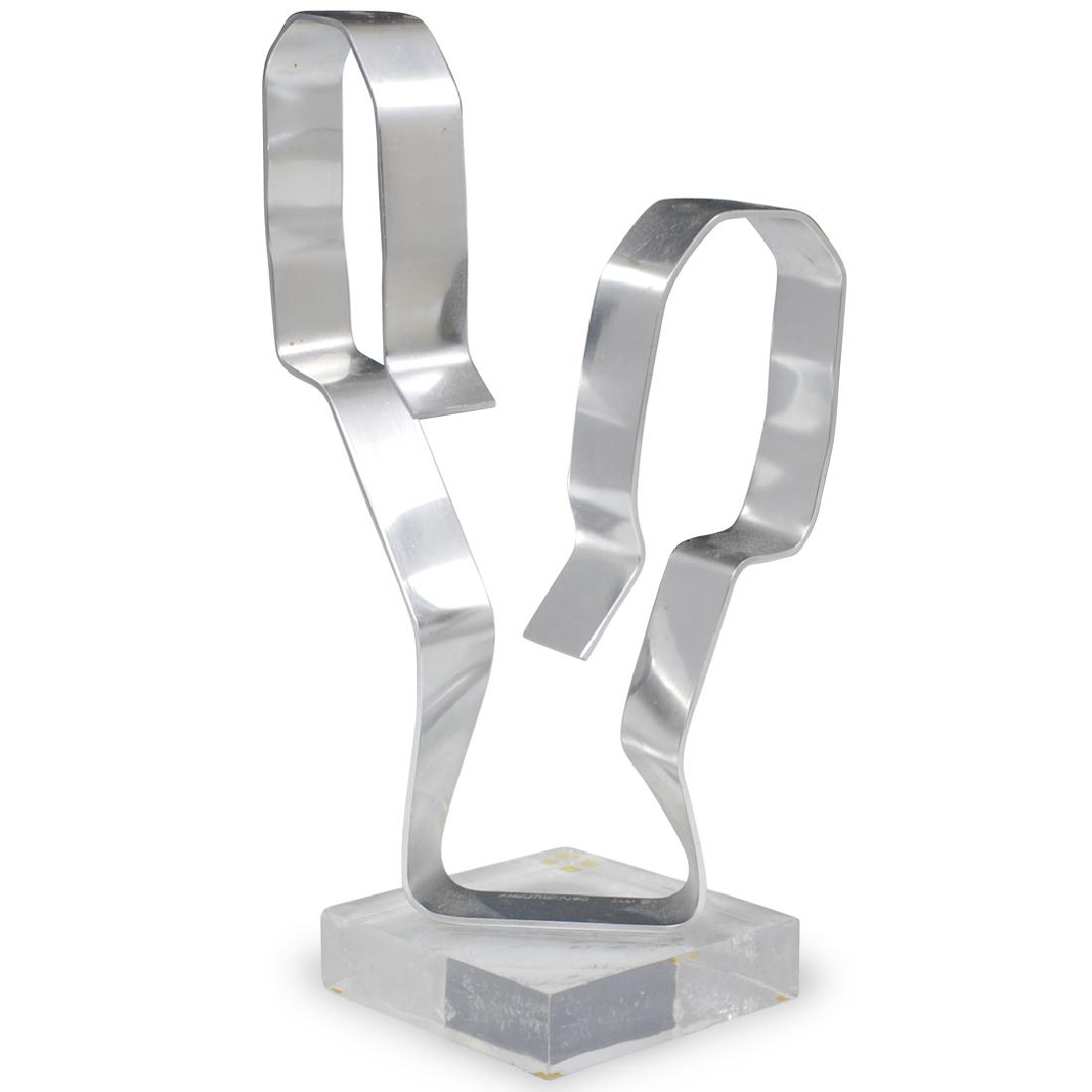 Dan Murphy Aluminum Ribbon Sculpture: DESCRIPTION: An aluminum ribbon sculpture by Dan Murphy. Depicts a single strand of aluminium emanating from a lucite base. Signed and dated, "Dan Murphy 1977". CIRCA: 1970s ORIGIN: USA DIMENSIONS: H.