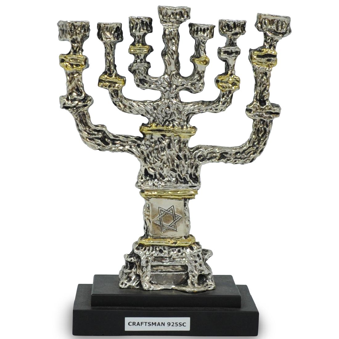 Sterling Silver Seven Branch Menorah: DESCRIPTION: A Sterling silver seven branch menorah. Marked '925" CIRCA: 20th Century ORIGIN: Israel DIMENSIONS: H. 9" x W. 7" CONDITION: Great condition. See lot description for details on item condi