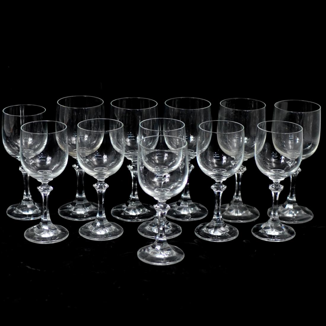 (12 Pc) Crystal Wine Glasses: DESCRIPTION: A Set of 12 crystal stemmed wine glasses. No apparent markings. CIRCA: 20th Century DIMENSIONS: H. 6.25" - 6.75" CONDITION: Good condition. See lot description for details on item conditi