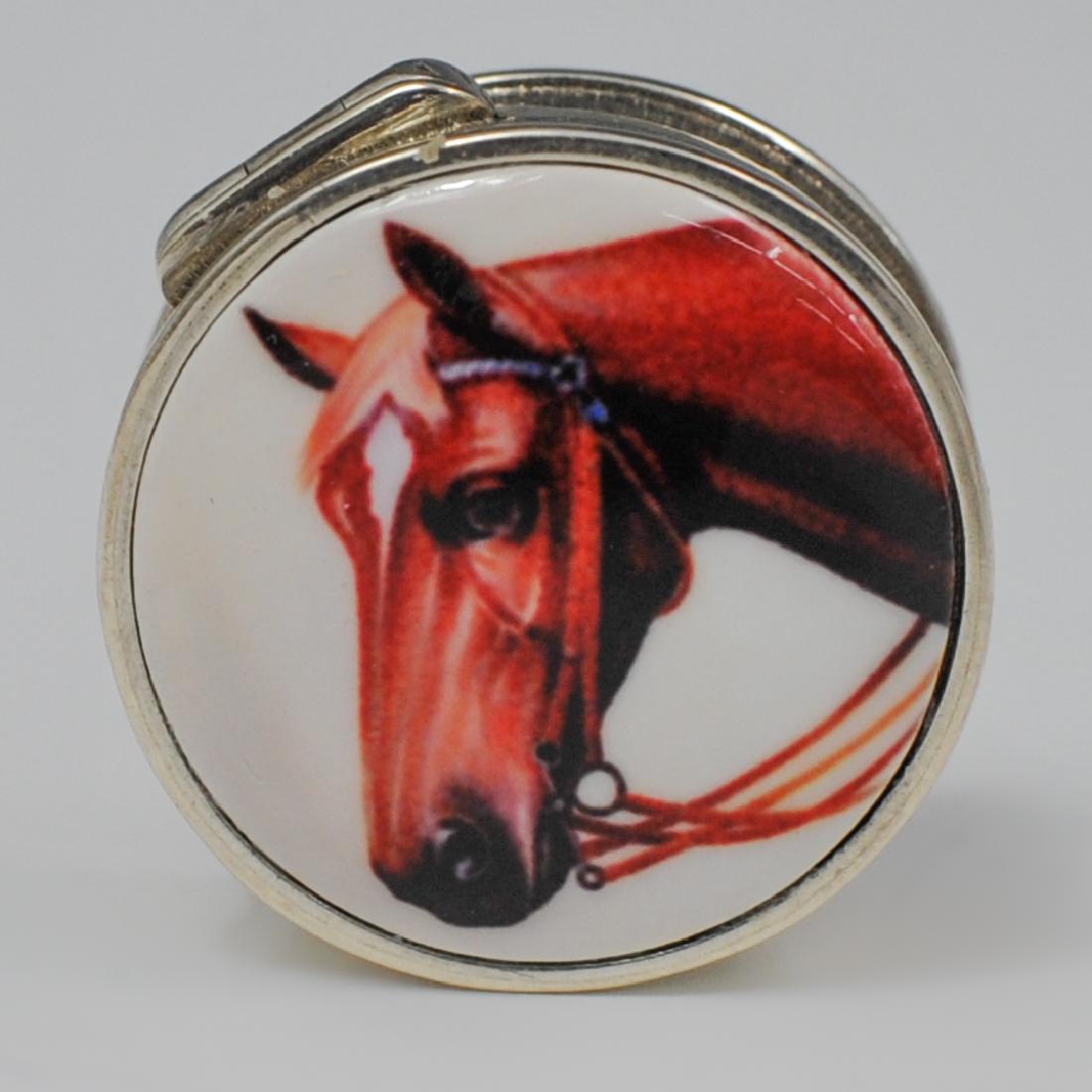 Sterling Silver Equestrian Enamel Pill Box: DESCRIPTION: A sterling silver pill box embellished along the lid with an enamel painting portraying a horse head, marked along the interior "Sterling" Weight: 24 grams CIRCA: 20th Cent. ORIGIN: Possi