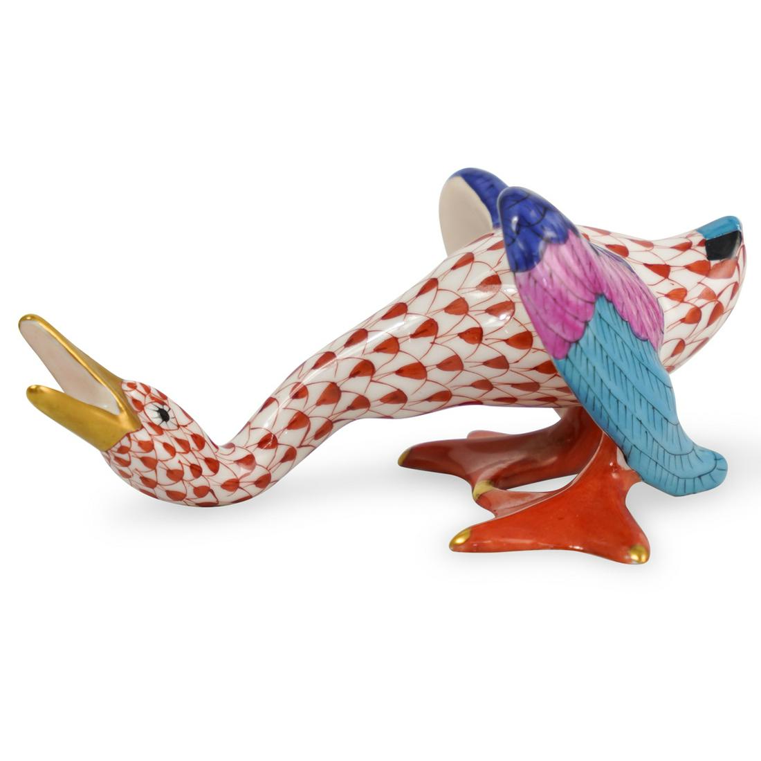 Herend Porcelain Fishnet Hissing Goose: DESCRIPTION: A Herend porcelain figurine depicts a hissing goose in an overall rusted tone fishnet pattern, further embellished with multicolored wings and gilded accents. Marked along the underside w