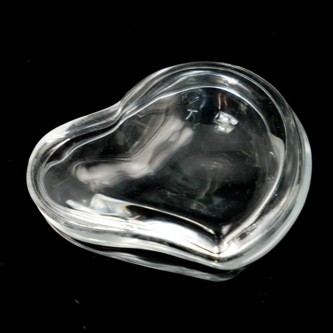 Tiffany & Co. Elsa Peretti Glass Jar: DESCRIPTION: A glass jar by Elsa Peretti and maker Tiffany & co. features in an overall heart motif, signed along the edge "Tiffany & Co. and Peretti" CIRCA: 20th Cent.Ã‚ ORIGIN: USA DIMENSIONS: H:
