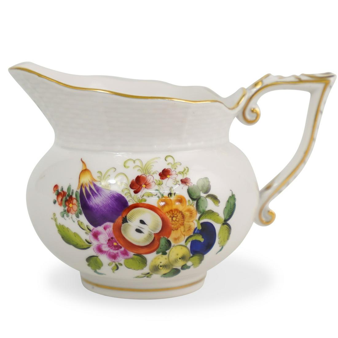 Herend Porcelain Floral CreamerÃ‚: DESCRIPTION: A Herend porcelain creamer decorate along the body with Bouquet patterns featuring multi colored flowers, completed along the rim and handle with gilded trim. Marked along the underside w