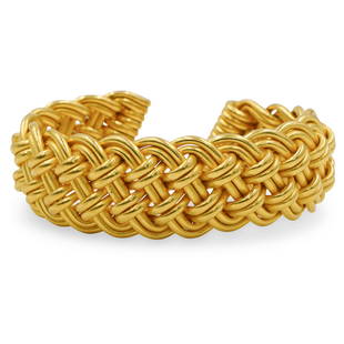 Verdura 22k Gold Bracelet: DESCRIPTION: A 22k yellow gold bracelet by designer Verdura, the bracelet features in an interwoven design completed by coiled ends. Stamped along the interior "Verdura". Total Weight: 101 Grams (65 d