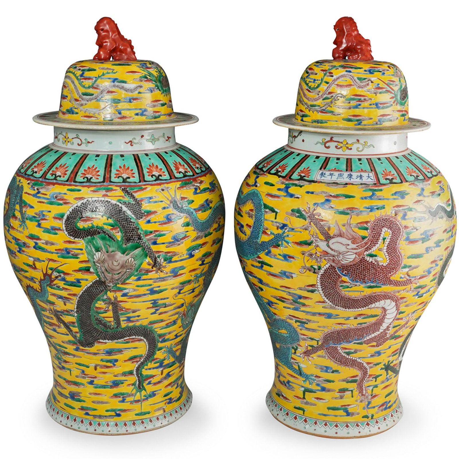 Pair of Famille Jaune Porcelain Urns: DESCRIPTION: A Pair of Famille Jaune Porcelain Urns, decorated in green and blue enamel on a yellow ground. features dragon and cloud motifs, the removable lid is fitted with an foo-dog finial. Marked