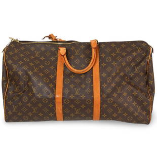 Louis Vuitton Keepall Bandouliere 45 Bag: DESCRIPTION: A Louis Vuitton Monogram Keepall Bandouliere 45 duffel, features vachetta cowhide leather trim including rolled top handles, and straps around the midline and side panels. The polished