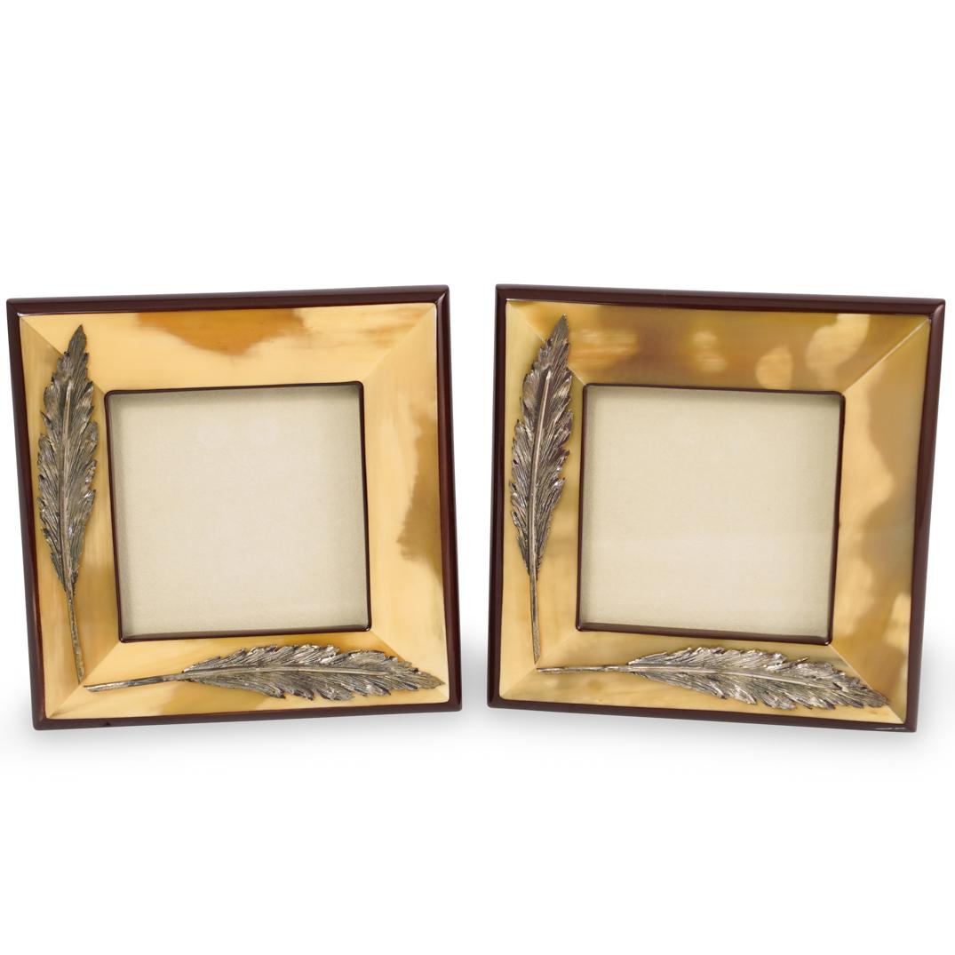 Pair Of Pireider Horn and Sterling Frames: DESCRIPTION: A pair of Pirieder picture frames feature an inlaid horn frame decorated with applied silver leaf applications, marked along the back "Pirieder" CIRCA: 21st Cent. DIMENSIONS: H: 6.25" W: