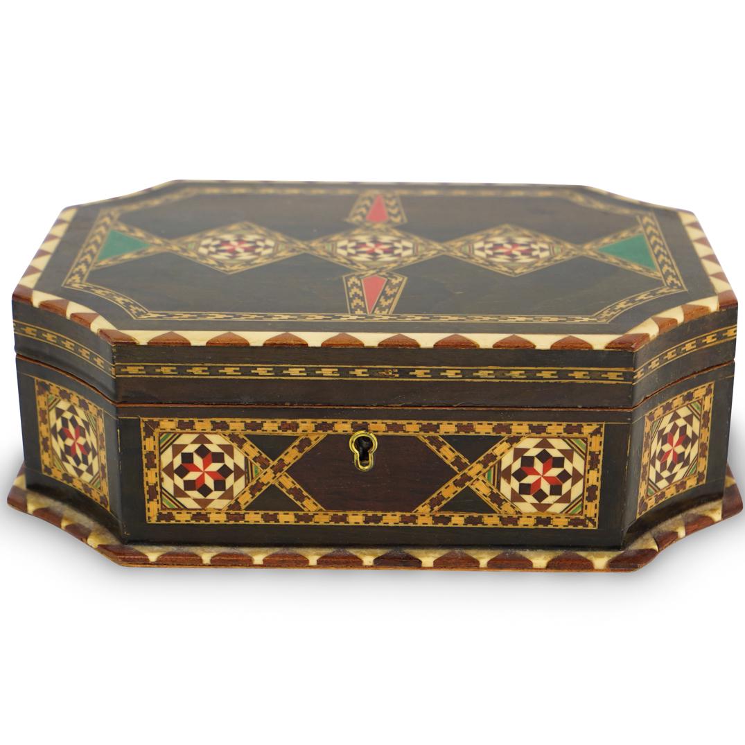 Moroccan Inlaid Jewelry Box: DESCRIPTION: A Moroccan Marquetry wood and bone inlaid jewelry box. Features octagonal shaped box with intricately inlaid canted lid, opening to a velvet lined lift out tray above a mirror plate. CIRC