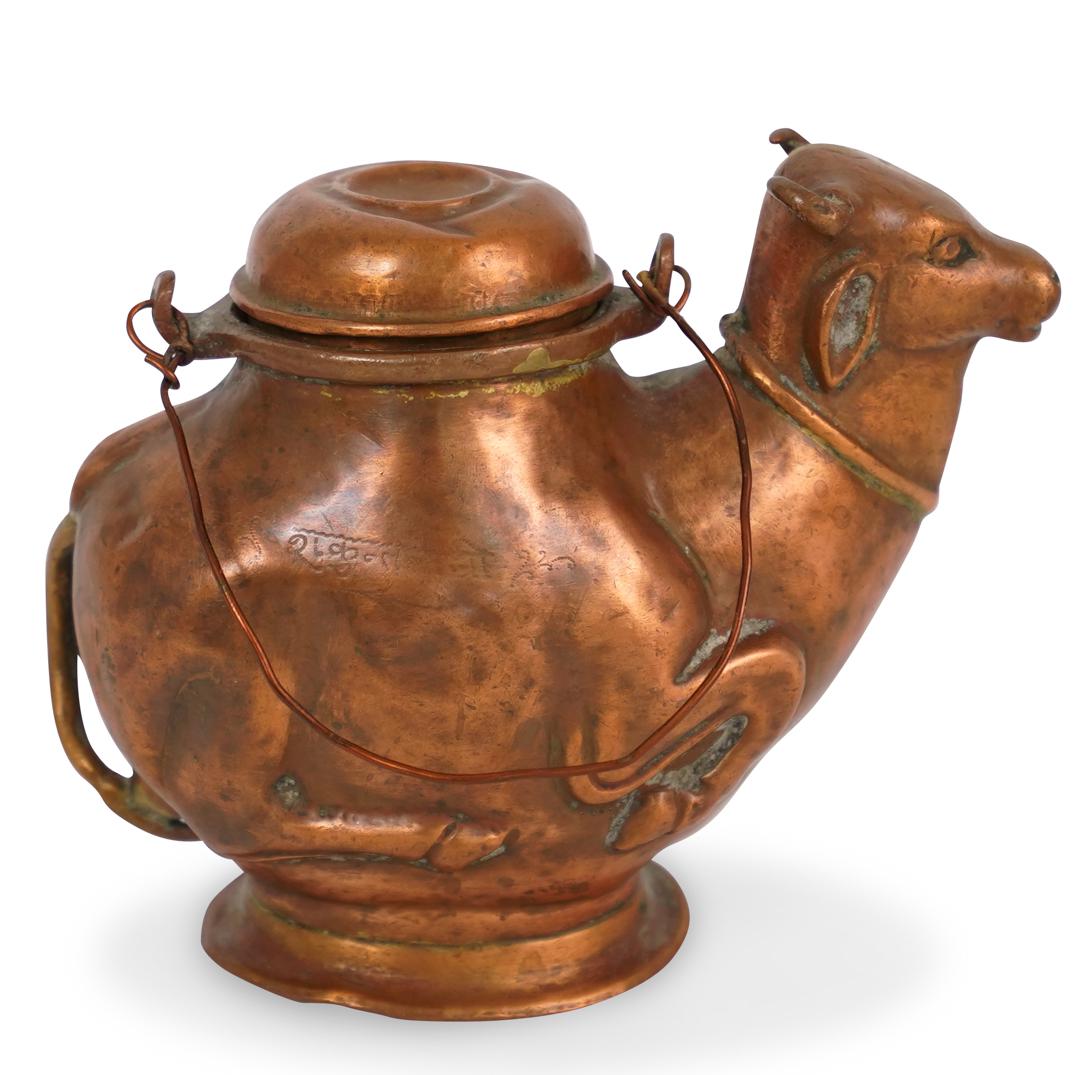 Copper Bull Vessel: DESCRIPTION: A copper bull water vessel or decorative teapot.Ã‚ CIRCA: 20th Century ORIGIN:Ã‚ DIMENSIONS: H. 4" x W. 5" CONDITION: Good condition. See lot description for details on item conditi