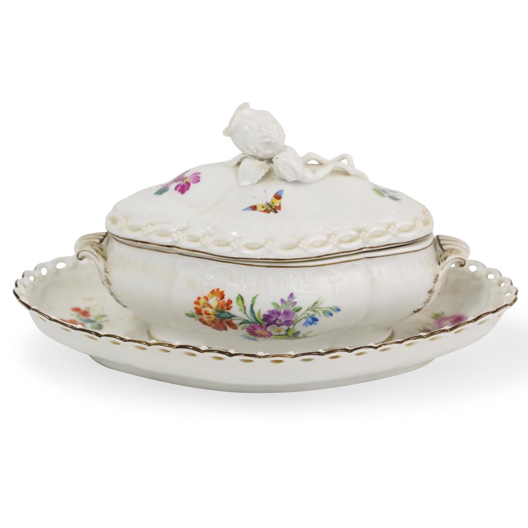 Antique KPM Gravy Boat: DESCRIPTION: An antique KPM porcelain lidded gravy boat with attached underplate, featuring floral and butterfly pattern and applied rose handle. Hallmarked on the underside with painted scepter. CIRC