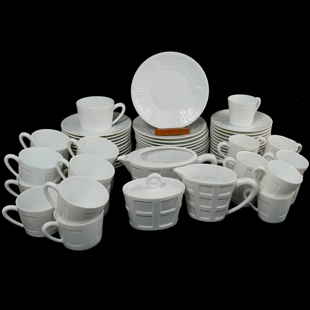 (62 Pc) Limoges Bernardaud Porcelain China Set: DESCRIPTION: A Limoges Bernardaud white porcelain coffee set features the following: 11 Large saucers 12 Medium saucers 12 Small Saucers 12 cappuccino Cups 12 Espresso Cups 1 Creamer 1 Sugar 1 Pitcher