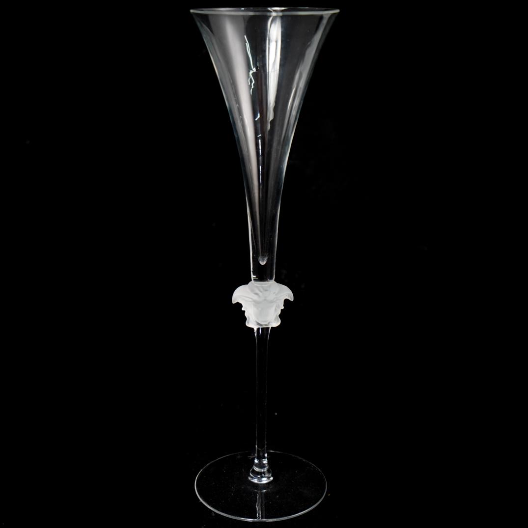 Rosenthal Versace Lumiere Champagne Flute: DESCRIPTION: A Versace for Rosenthal Lumiere champagne flute. Crafted from hand blown and shaped glass. Decorated with the face of Medusa in frosted glass. Stamped. CIRCA: 20th Century ORIGIN: Germany