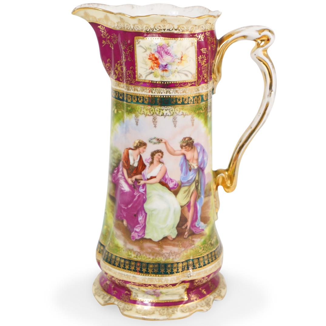 E.S. Germany Porcelain Pitcher: DESCRIPTION: An E.S. Germany Porcelain Pitcher, transfer-decorated figural scenes with vibrant enamel decoration. Marked "Prov. Saxe/E.S. Germany" with Royal Vienna beehive. CIRCA: Early 20th Century