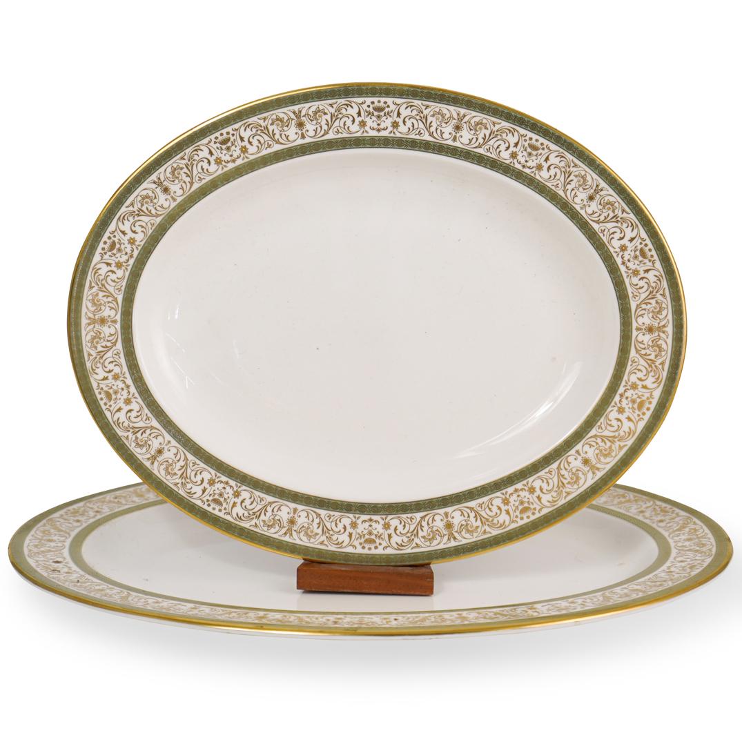 Pair of Mintons Bone China Serving Trays: DESCRIPTION: A pair of Mintons Fine Bone China serving trays, in the "Aragon" pattern, depicts a gilded vine motif along the border. Marked on the underside. CIRCA: 20th Century ORIGIN: England DIMENS