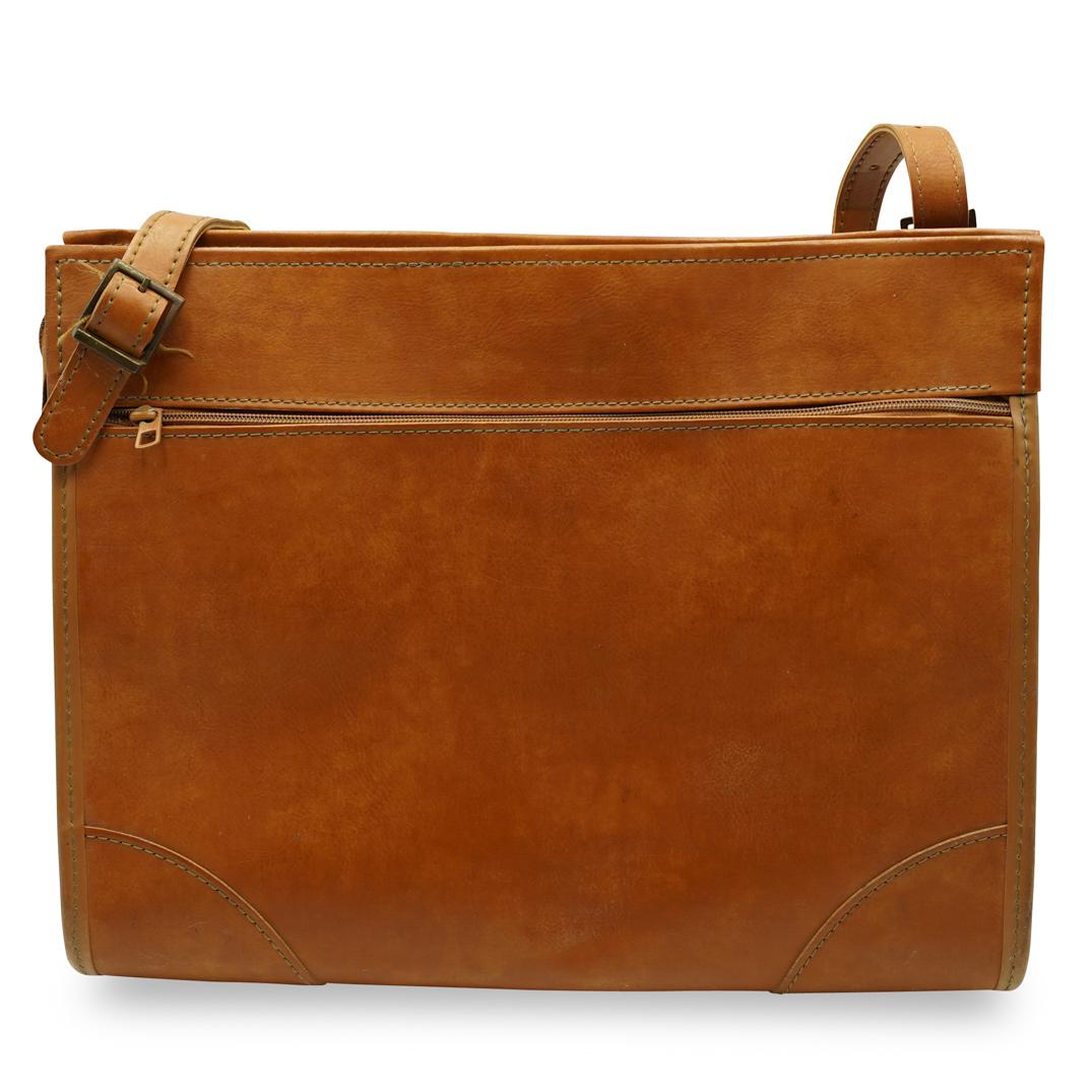 Vintage Hartmann Luggage Travel Bag: DESCRIPTION: A Vintage leather Hartmann travel bag features in tan leather with double sided zipper compartments. The bag opens revealing a paisley patterned interior, with storage compartment. Tagged