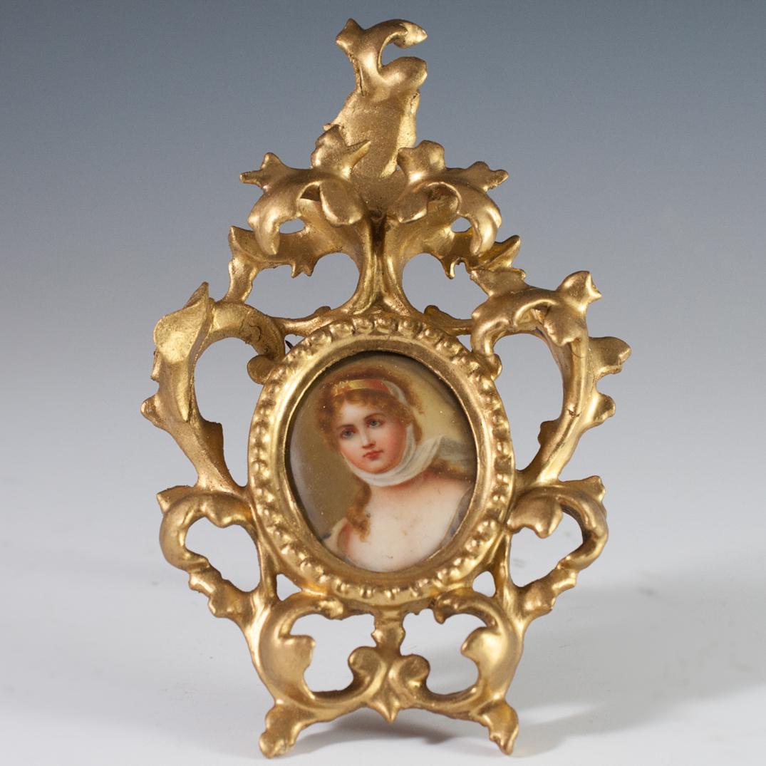 Italian Carved Wood and Porcelain Portrait: DESCRIPTION: Hand Painted porcelain plaque of Konigin Louise, Luise von Mecklenburg-Strelitz, or Queen Louise of Prussia after the original by Gustav Karl Richter. Set in a gilded wood frame carved wi