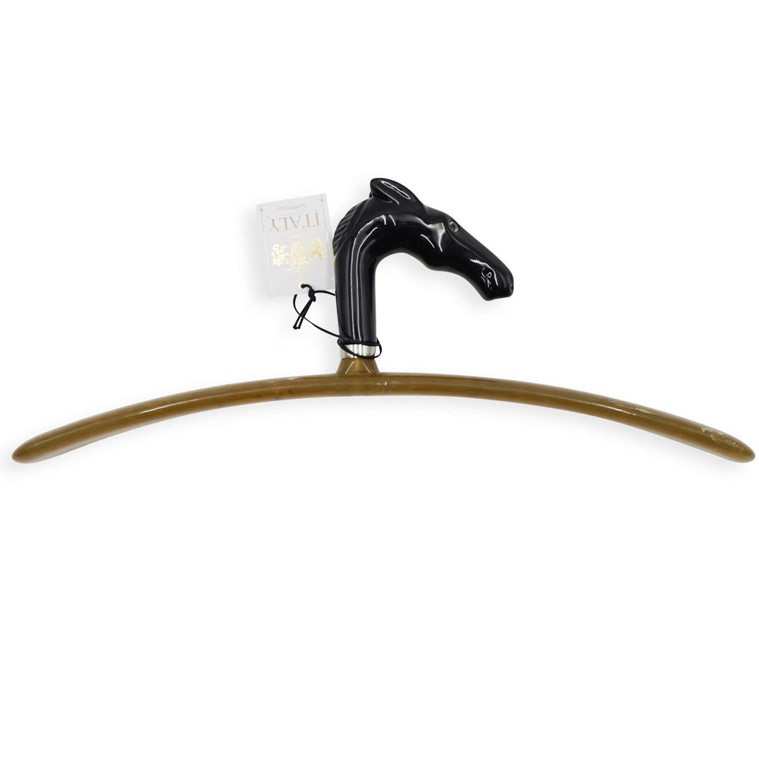 Vintage Italian Shoe Horn: DESCRIPTION: A Vintage Italain shoe horn composed of bakelite and acrylic, decorated at the top with a black toned horse head, tagged: "Created in Italy". CIRCA: Mid-Late 20th Cent. ORIGIN: Italy DIME