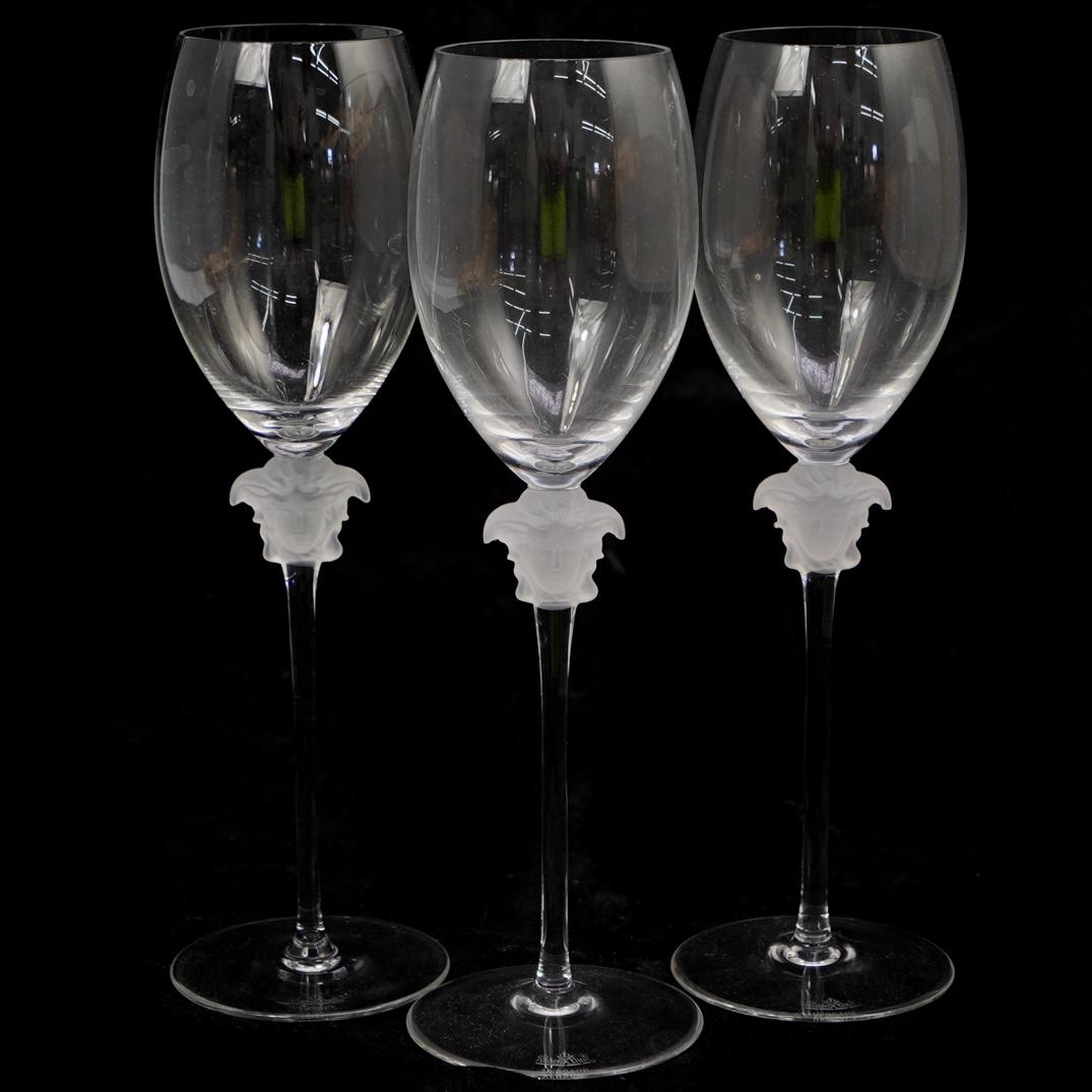 (3 Pc) Rosenthal Versace Lumiere White Wine Glasses: DESCRIPTION: A 3-piece Versace for Rosenthal Lumiere white wine glasses. Crafted from hand blown and shaped glass. Decorated with the face of Medusa in frosted glass. Stamped. Two in original boxes. C