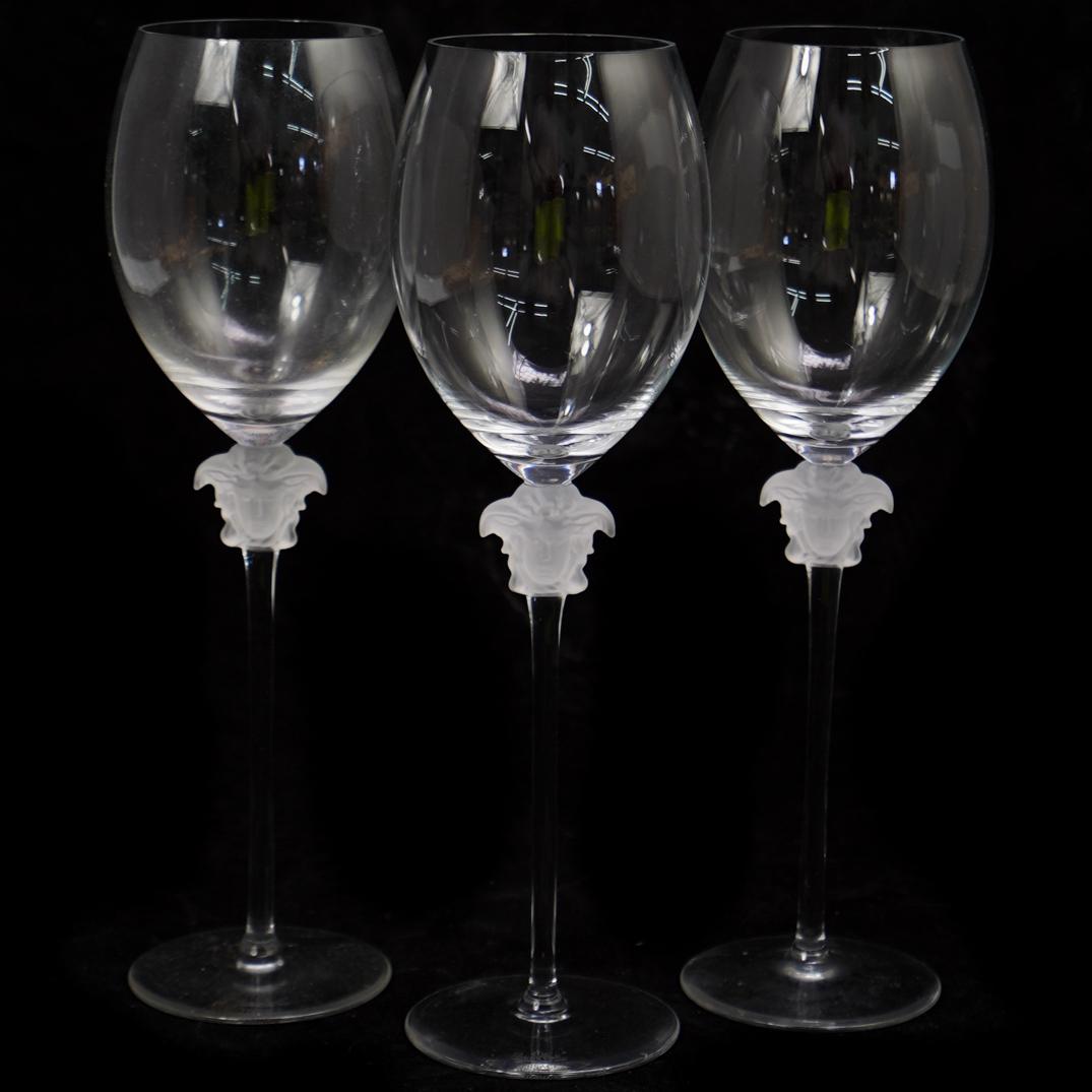(3 Pc) Rosenthal Versace Lumiere Red Wine Glasses: DESCRIPTION: A 3-piece Versace for Rosenthal Lumiere red wine glasses. Crafted from hand blown and shaped glass. Decorated with the face of Medusa in frosted glass. Stamped. Three in original boxes. C