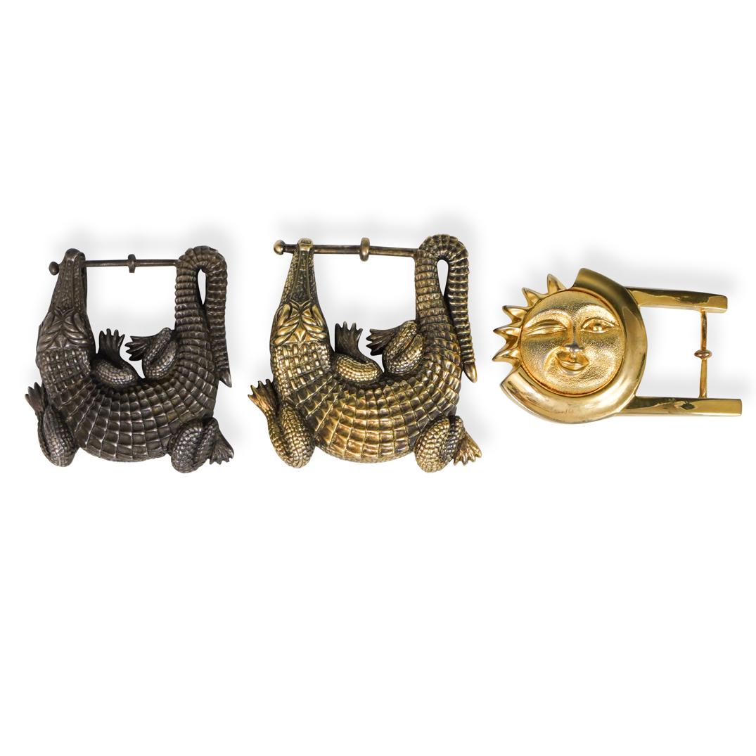(3 Pc) Kieselstein Cord Style Belt bucklesÃ‚: DESCRIPTION: Three Barry Kieselstein Cord metal belt buckles in silver and gilded tones. Each buckle depicts an alligator biting on the belt bar or a Sun face. Unmarked. CIRCA: 20th Cent. ORIGIN: USA 
