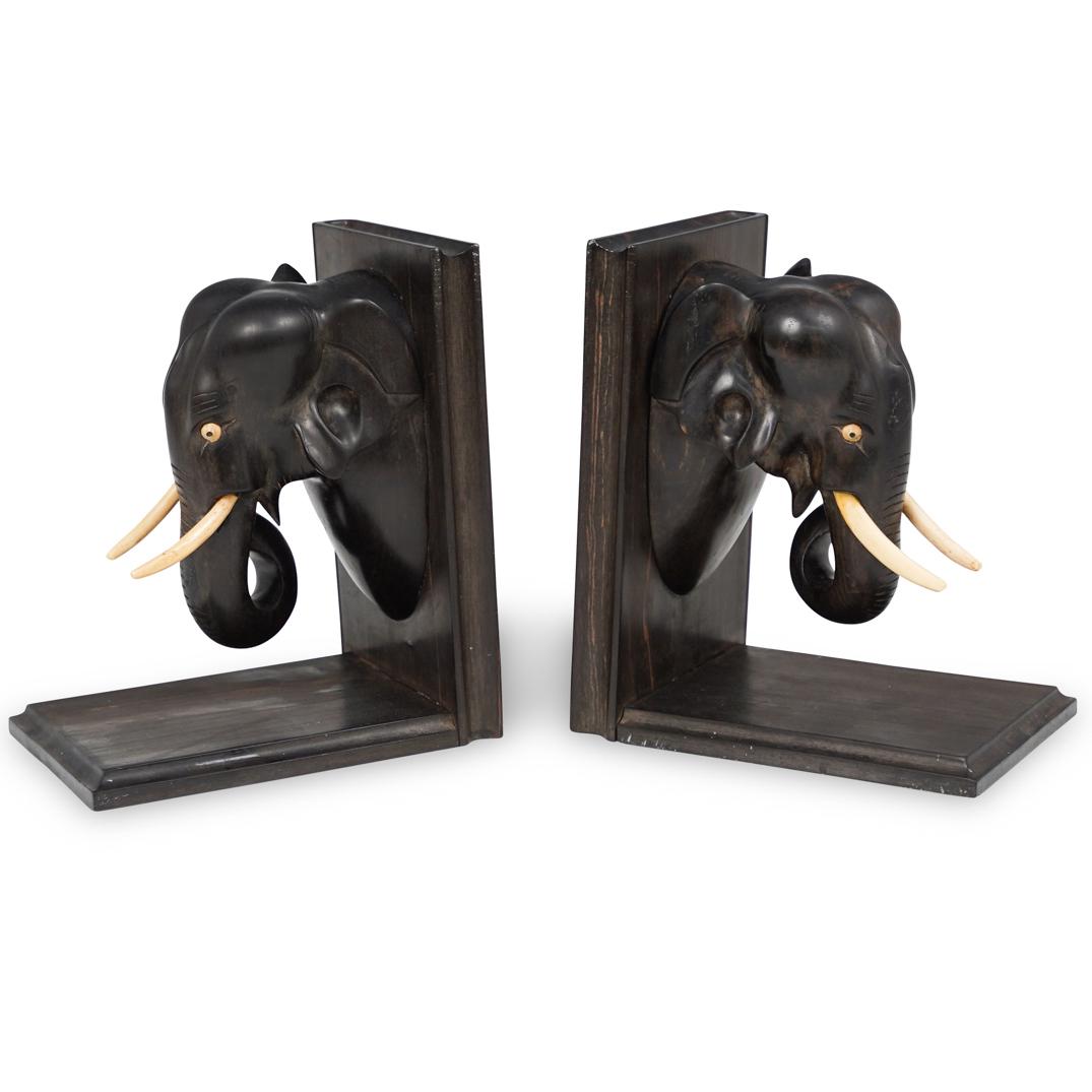 Pair of Vintage Ebony & Bone Elephant Bookends: DESCRIPTION: A Pair of Ebonized wood and bone carved elephant bookends with carved bone tusks and eyes. CIRCA: Early 20th Century ORIGIN: Continental DIMENSIONS: H. 8" x W. 7" CONDITION: Good conditio
