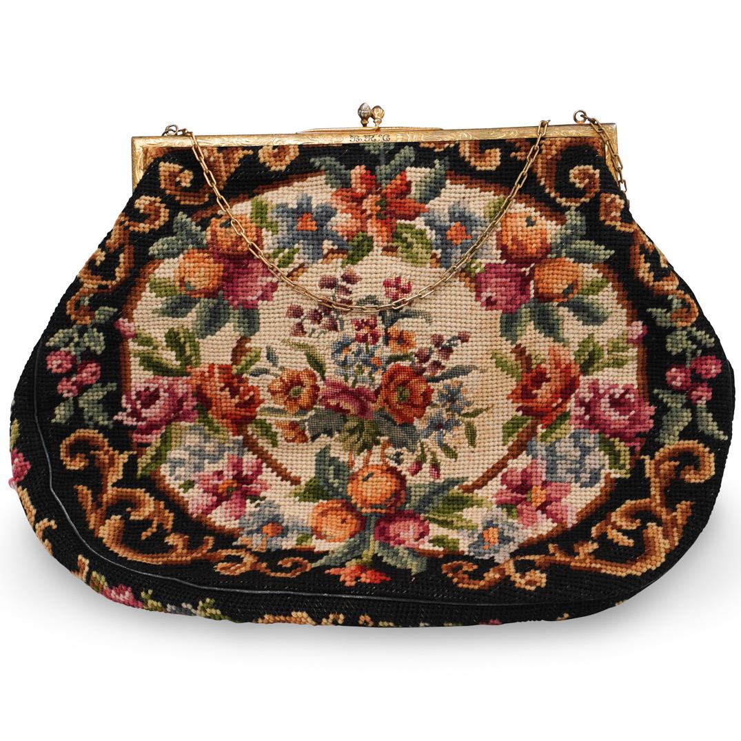 Antique Embroidered Handbag: DESCRIPTION: A hand embroidered handbag with floral pattern, with a sterling silver closure and chain. Marked "925 Sterling" CIRCA: 20th Century ORIGIN: Continental DIMENSIONS: L. 15" CONDITION: Great