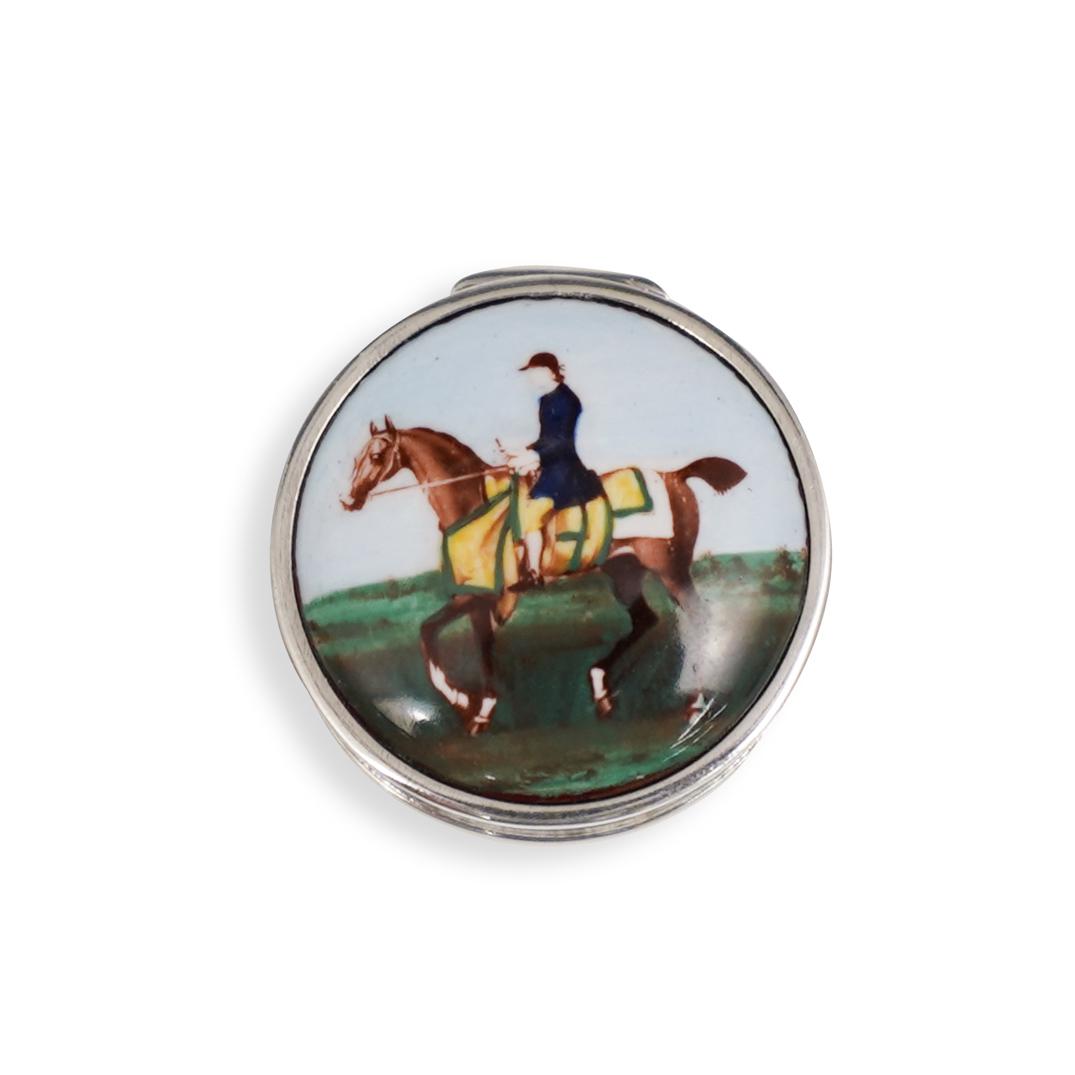 Sterling Silver and Enamel Pill Box: DESCRIPTION: A Sterling silver and enamel circular pill box. Features a gentleman on horseback. Marked "925". Weight: 16.4 grams. CIRCA: 20th Century ORIGIN: Continental DIMENSIONS: L. 1" CONDITION: G